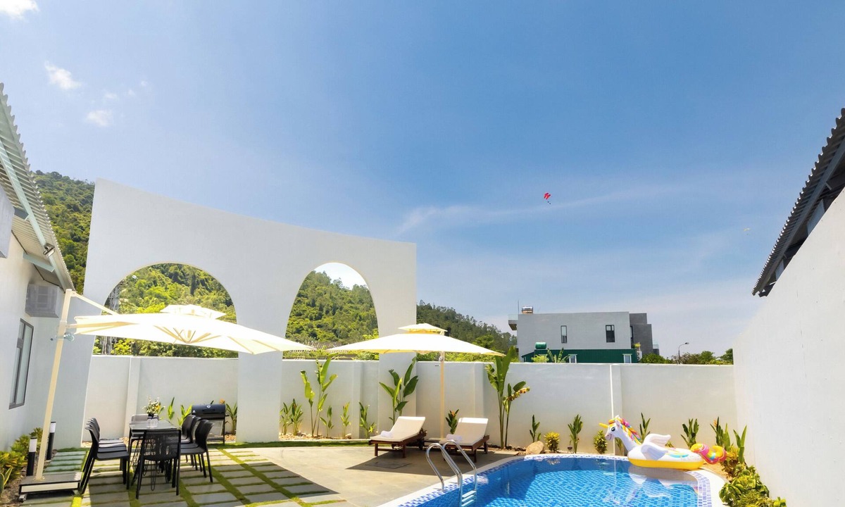 Tho Quang Beach Villa | Minimalist-style private villa with unique arched gatewat design & private pool