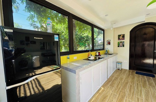 Lao Cai Apartment | Cozy Haven Nest – Sunlit Glass & Green Views