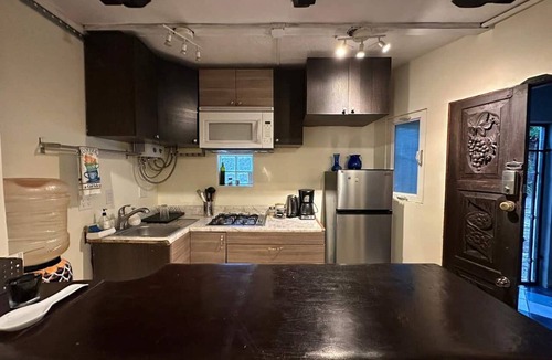 San Antonio del Mar Apartment | Cozy studio 3 blocks from the beach in San Antonio del Mar. Enjoy a private rooftop terrace with our signature galactic whale mural, community pools & tennis courts, and a secure 24/7 gated community. Perfect for couples or small groups.