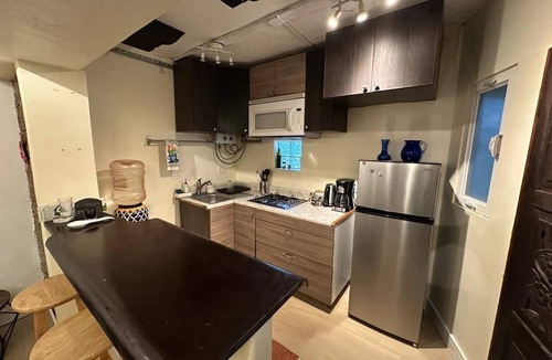 San Antonio del Mar Apartment | Cozy studio 3 blocks from the beach in San Antonio del Mar. Enjoy a private rooftop terrace with our signature galactic whale mural, community pools & tennis courts, and a secure 24/7 gated community. Perfect for couples or small groups.