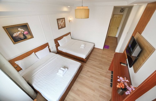 District 1 Hotel | Deluxe Family Room with City View