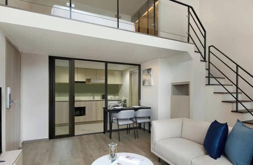 Phra Khanong Apartment | Elevated Corner Retreat with Balcony and Stunning City Views