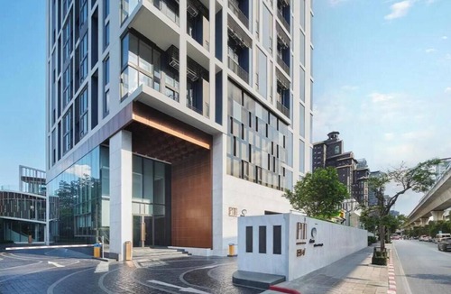 Phra Khanong Apartment | Elevated Corner Retreat with Balcony and Stunning City Views