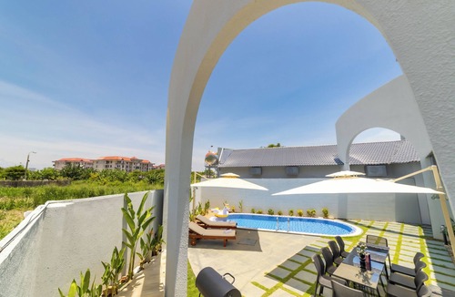 Tho Quang Beach Villa | Minimalist-style private villa with unique arched gatewat design & private pool