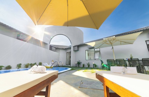 Tho Quang Beach Villa | Minimalist-style private villa with unique arched gatewat design & private pool
