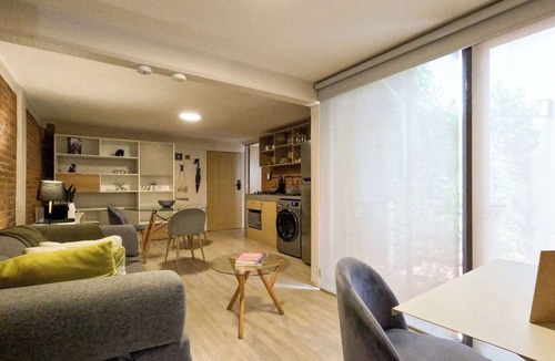 Del Carmen Apartment | Modern brick retreat in Coyoacán | Patio