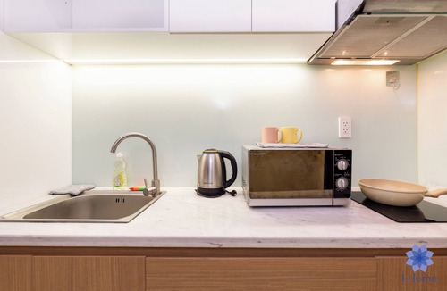 Tan Binh Apartment | Serene apartment with AC in vibrant HCM, Near TSN Airport 1.3km, Kitchen, Washer