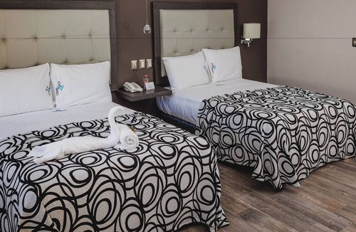Centro Hotel | Three Modern and Vibrant Rooms Just Minutes from Attractions, Shops, and Dining